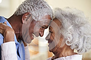 Profile Shot Loving Senior Couple Head To Head At Home Together