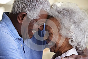 Profile Shot Loving Senior Couple Head To Head At Home Together