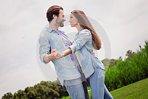 Profile side photo of good mood excited couple dancing love story celebrate anniversary honeymoon outdoors