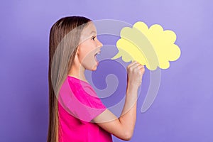 Profile side photo of happy amazed young small girl say tell news announce cloud isolated on violet color background