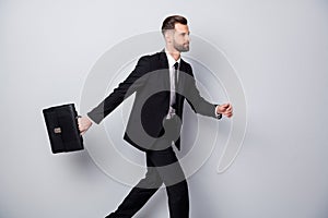 Profile side photo of serious confident cool worker go run hurry for job recruitment meeting event hold handbag wear