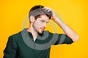 Profile side photo of serious minded guy look in mirror touch his hair after new anti dander effect shampoo wear casual