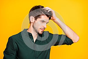 Profile side photo of serious minded guy look in mirror touch his hair after new anti dander effect shampoo wear casual photo