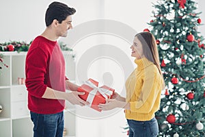 Profile side photo of two romantic people give exchange gift box enjoy christmas midnight follow newyear tradition feel