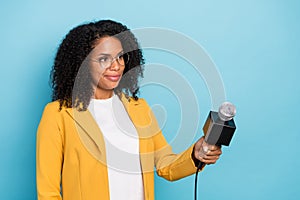 Profile side photo of young black woman mass media news journalism hold microphone isolated over blue color background