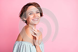 Profile side photo of young cheerful girl happy positive smile hand touch shoulder isolated over pink color background