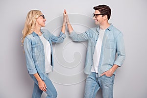 Profile side photo of young couple happy positive smile give high-five glad isolated over grey color background
