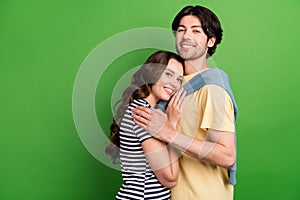 Profile side photo of young couple happy positive smile hug embrace trust suppport isolated over green color background