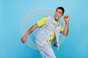 Profile side photo of young excited african guy good mood dancer clubber isolated over blue color background