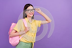 Profile side photo of young school girl eyewear smart rucksack courses isolated over violet color background