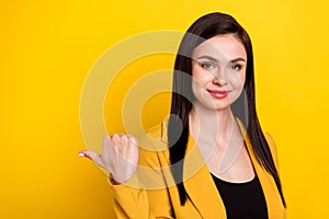 Profile side photo of young woman happy positive smile point thumb empty space ad advice suggest isolated over yellow