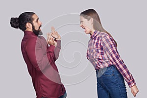 Profile side view portrait of angry woman standing and screaming