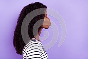 Profile side view portrait of attractive dreamy amorous girl sending air kiss copy space isolated over violet purple