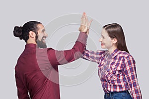 Profile side view portrait of happy amazed bearded man and woman