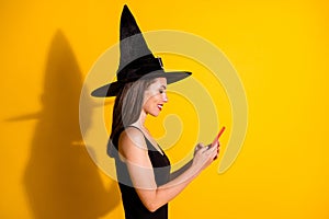 Profile side view portrait of her she attractive pretty focused addicted cheerful lady wizard using gadget app 5g