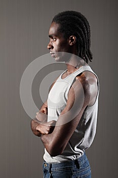 Profile of tough young black man with dreadlocks