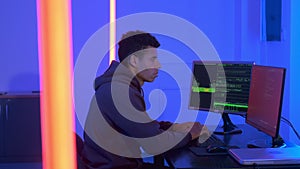 Profile view of african programr working in cyber security center