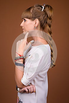 Profile view of beautiful blonde woman with braided hair