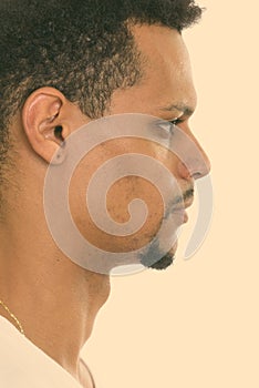 Profile view of face of young African man