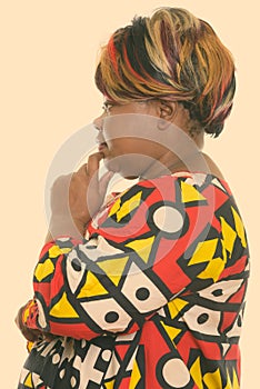 Profile view of fat black African woman thinking