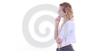 Profile view of happy beautiful blonde woman thinking