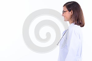 Profile view of happy beautiful woman doctor with eyeglasses smiling