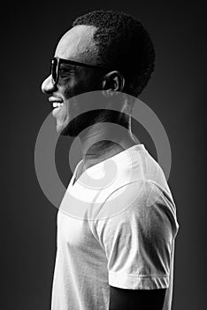 Profile view portrait of young African man smiling