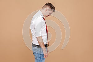 Profile view of unhappy loss businessman
