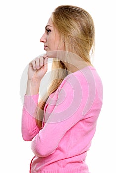 Profile view of young beautiful teenage girl thinking