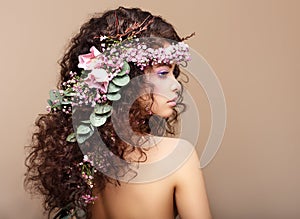 Profile of Woman with Colorful Wreath of Flowers.