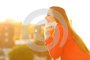 Profile of a woman keeping warm in winter