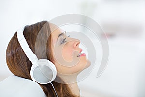 Profile woman wearing headphones