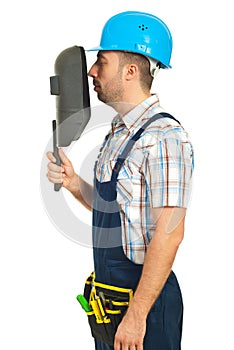 Profile of worker man with welding mask