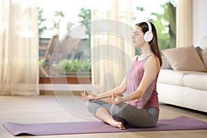 Yogi doing guided yoga course at home photo