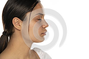 Profile of a young beautiful woman with closed eyes