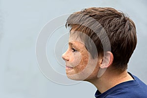 Profile of a young boy with freckles