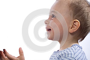 Profile of a young boy smiling