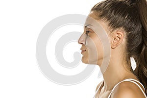 Profile of young smiling woman without makeup