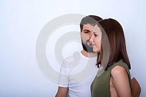Profile of young woman on the face of young man background
