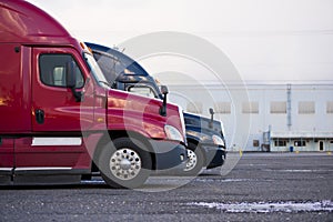 Profiles semi trucks modern color red blue on parking lot