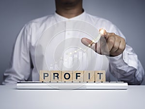 Profit concept. The blue words `profit` on wooden cube blocks.