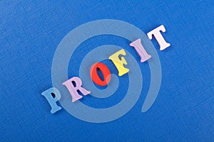 PROFIT word on blue background composed from colorful abc alphabet block wooden letters, copy space for ad text. Learning english