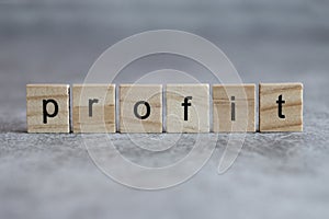 Profit word written on wood cube