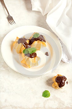 Profiteroles with chocolate sauce