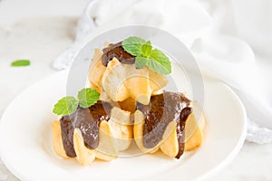 Profiteroles with chocolate sauce
