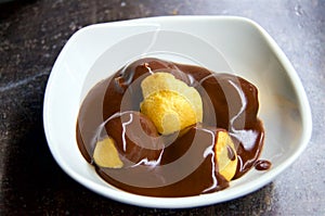 Profiteroles with chocolate topping