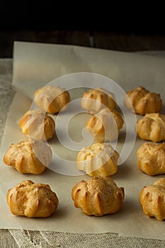 Profiteroles on cooking paper