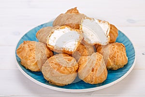 Profiteroles Fresh Cream puffs cakes filled with pastry cream an