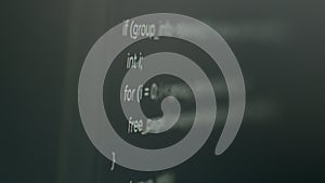 Program code on computer screen with software development database