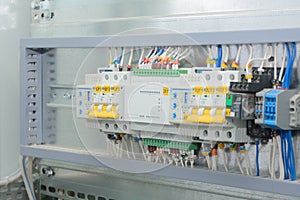 Programmable logic controller, automatic input of power reserve in the electrical cabinet. Close-up, selective focus